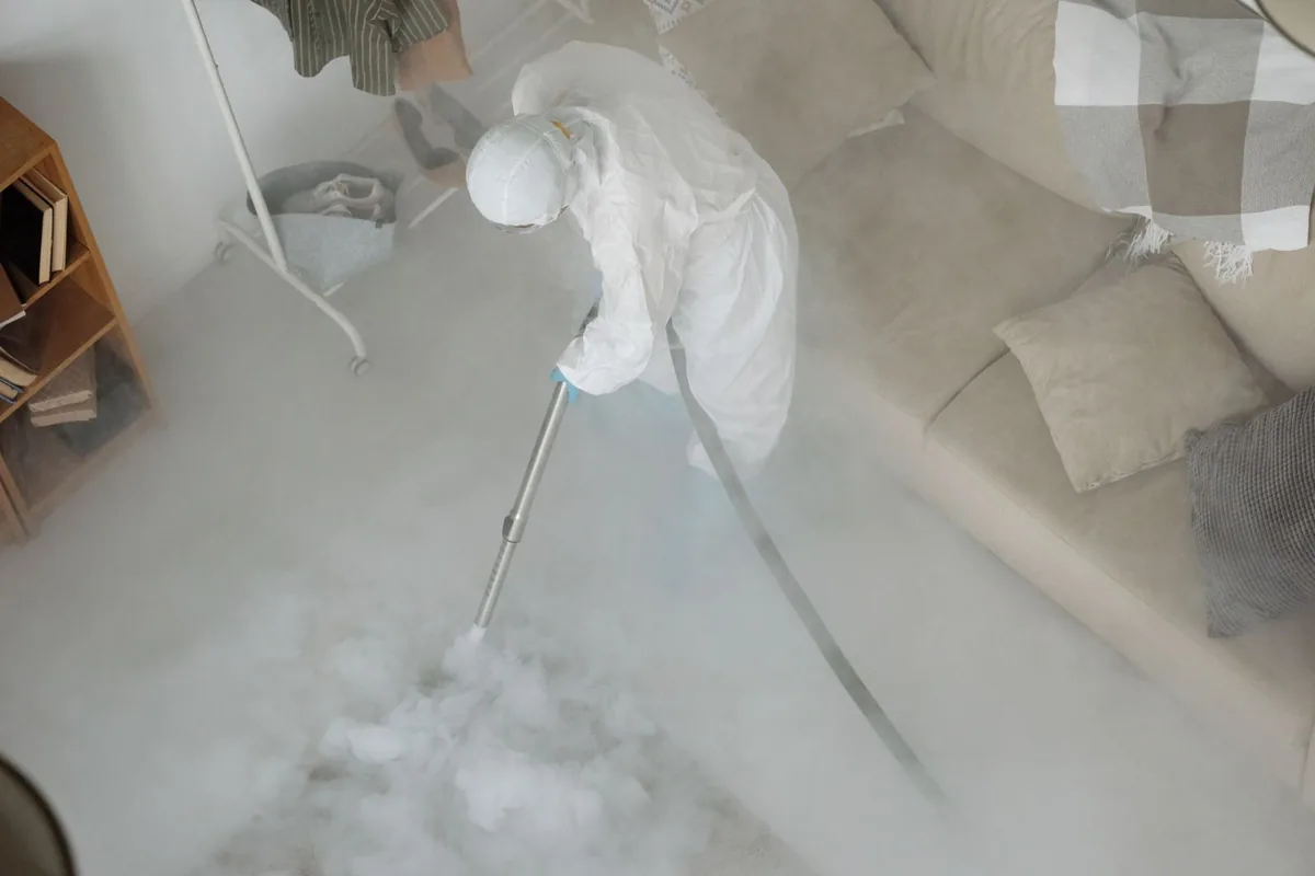 Biohazard cleanup technician in protective equipment, Tremont, PA